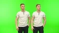 The twin brothers gesture on the green background 4k or 4k+ Resolution