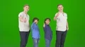 The twin brothers thumb up on the green background 4k or 4k+ Resolution
