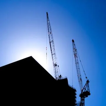 Twin cranes Stock Photos