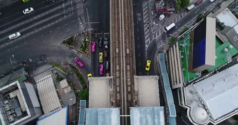 Twin elevated tracks splitting a wide junction from overhead 71298803