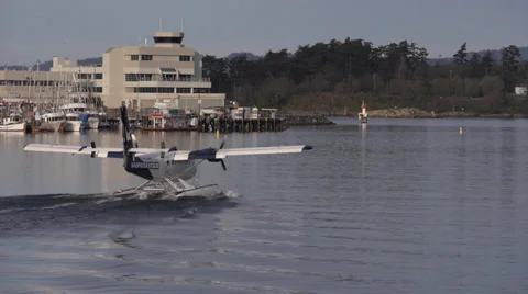Twin Engine Float Plane Taxies from Victoria Harbor Video stock 38127536