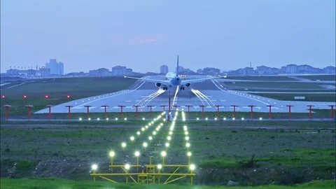 Twin-Engine Jet Performing Challenging Landing in Windy Weather During Evening L Stock Footage 326175530