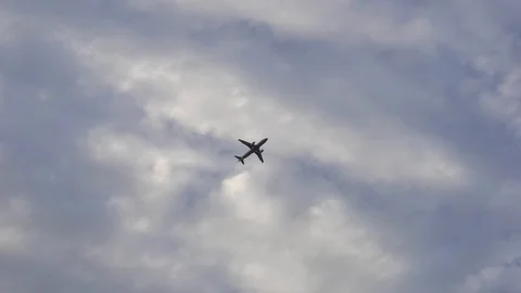 Twin-engine plane against a background of clouds Stock Footage 88950343