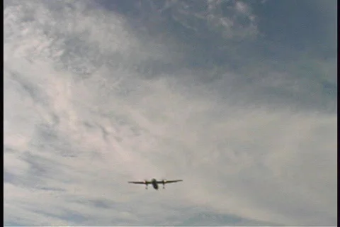 Twin Engine Plane Flies Over a Busy Highway Airplane Stock Footage 149386