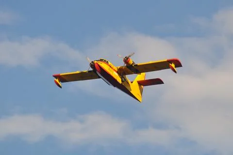 Twin engine plane flying in the sky Stock Photos