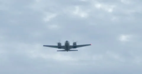 TWIN ENGINE PROP AIRPLANE - FLYOVER - SLOW-MOTION - DRAMATIC Stock Footage 165621592