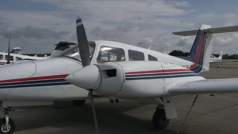 Twin engine prop planes on runway Stock Footage 70973661