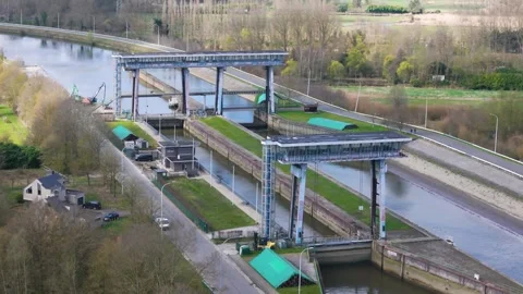 Twin lock complex towering steel lift gates glass control bridges spans parallel 動画素材 330723845