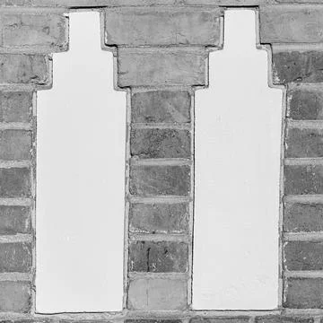 Twin Plaster Columns in Red Brick Wall 스톡 사진