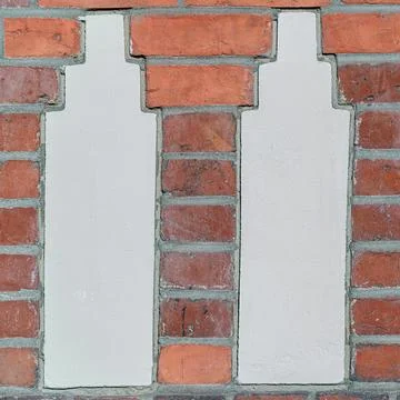 Twin Plaster Columns in Red Brick Wall 写真素材