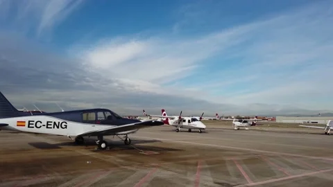 Twin propeller plane passing by taxy way looking for runway. Stock Footage 229917918