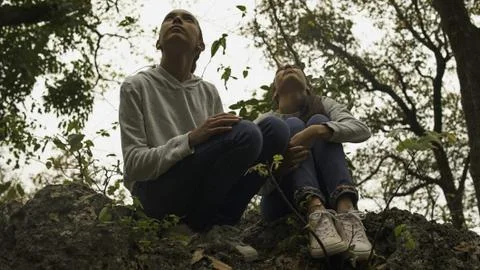 Twin Sisters On A Rock Looking Up. Stock Photos