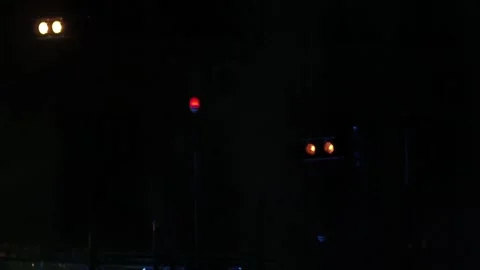 Twin spotlights and multiple red lights flash in the dark on stage 스톡 동영상 155211286