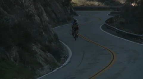 Twincyclists downhill follow Stock Footage 1065967