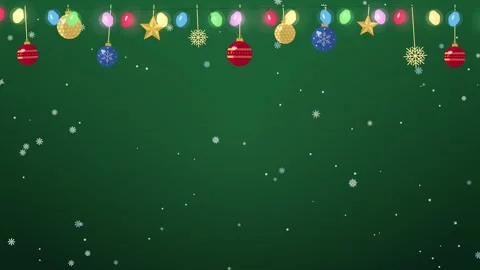 Twinkling Christmas string lights and hanging ornaments on green with copy space 库存影片 348258689