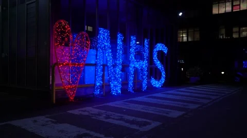 Twinkling illuminated NHS Heart Sign at Northwick Park Hospital, Harrow - 1 Stock Footage