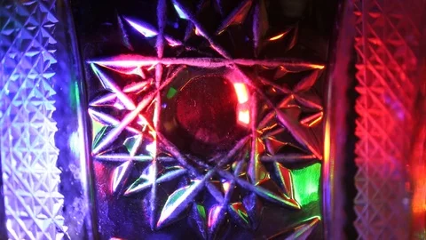 Twinkling multicolored rays of light against background with different patterns Stock Footage 105941986