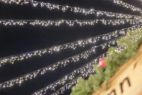 Twinkling String Lights Against Night Sky in Luebeck at chistmas marked Stock Photos