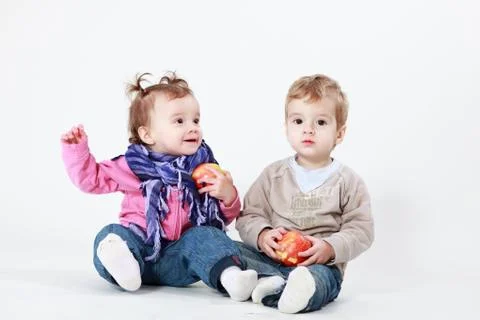 Twins with apples Stock Photos