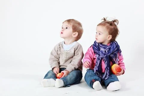 Twins with apples Stock Photos