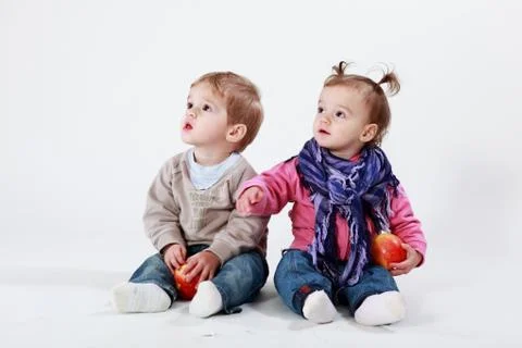 Twins with apples Stock Photos