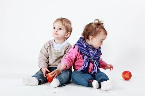 Twins with apples Stock Photos