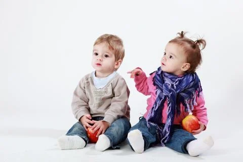 Twins with apples Stock Photos