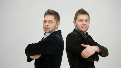 Twins are back to back and fold my arms Stock Footage 22222646