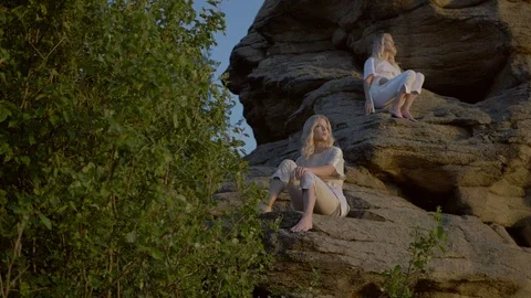 Twins are looking at the sunset Stock Footage 92165985