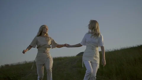 Twins are running on the grass Video stock 92162459