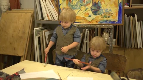 Twins boys 2 years old at drawing lesson Stock Footage