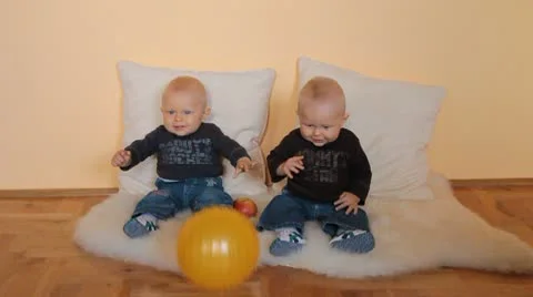 Twins boys with ball Stock Footage 10606181