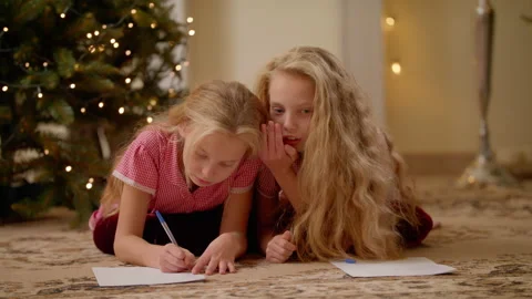 Twins Lying In Room And Write Letter To Santa Claus Near Christmas Tree Video stock 143041284