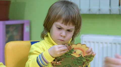 Twins play in a logical toy Stock Footage 64123770