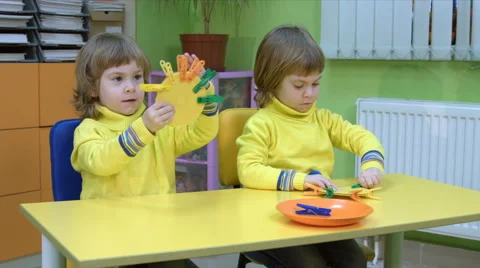 Twins playing an educational game Stock Footage 64124294