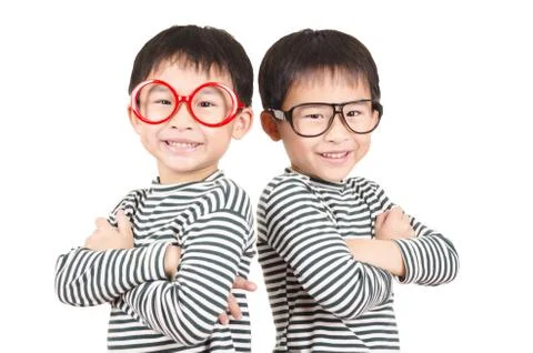 Twins smiling on white background Stock Photos