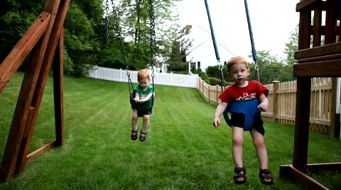 Twins on swings Video stock 458743