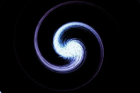 Twirl motion of bright explosion flash on black backgrounds Stock Photos