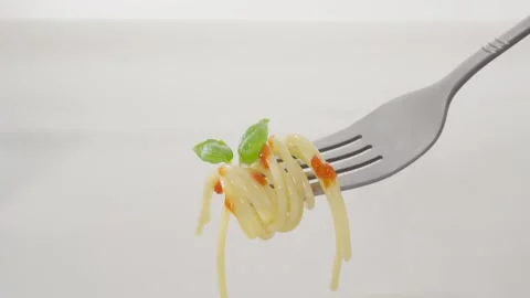 Twirled Spaghetti with Basil and Sauce on a Fork. Stock Footage 285489222