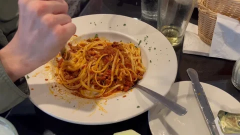 Twirling Spaghetti Bolognese Noodles with Fork in White Plate Stock Footage 341278341