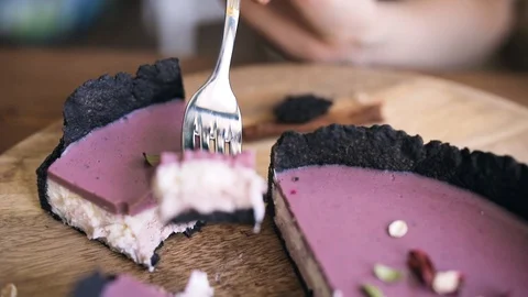 Twirls a piece of cake on a fork in front of the camera. Close up Stock Footage 129234530