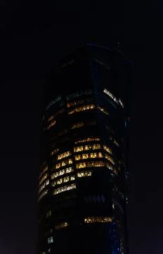 Twisted architecture of Al Bidda Tower illuminated at night, Al Dafna, Doha Stock Photos