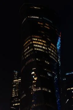 Twisted architecture of Al Bidda Tower illuminated at night, Al Dafna, Doha Stock Photos