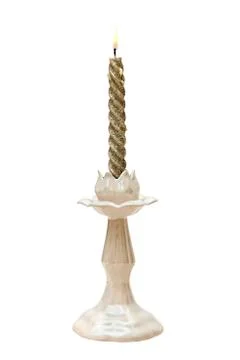 Twisted candle in a candlestick Faience Stock-Fotos