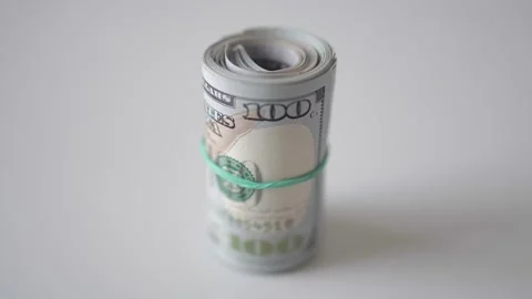 Twisted dollars in a cutlet.  Macro shot of usd dollars Stock Footage 175332461