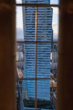 Twisted Glass Skyscraper Viewed Through Grid in Warsaw, Poland Stock Photos