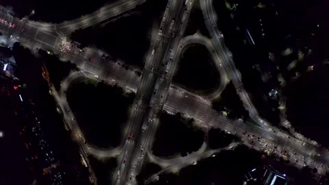 Twisted Night Highway Interchange Pattern From Direct Overhead Stock Footage 345268548