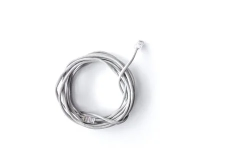 Twisted pair grey network Internet cable isolated over white background. Top Stock Photos