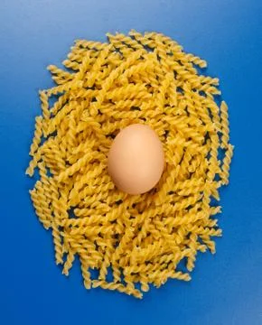 Twisted pasta with egg Stock Photos