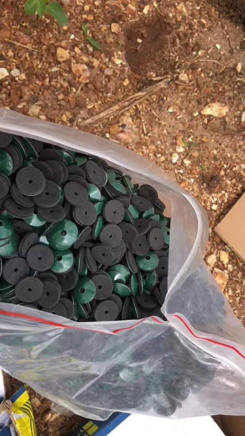 Twisted Roofing Nails,  self sealant and  Nail Caps in Bags at Construction Site Stock Footage 312485832